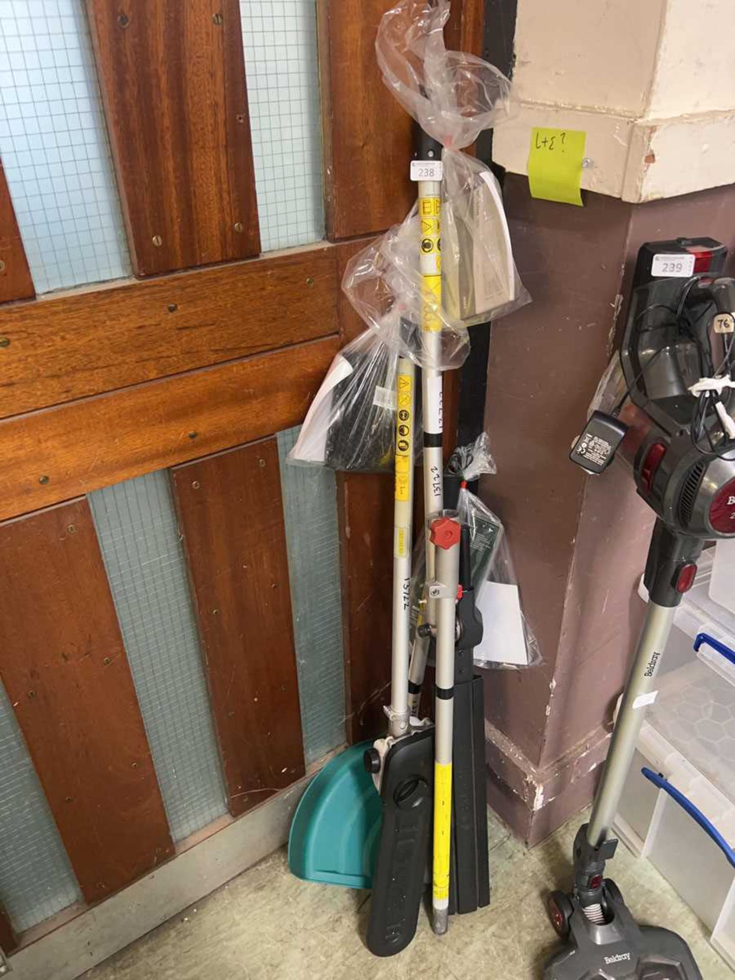An assortment of Bosch attachments to include strimmer, hedge trimmer, etc