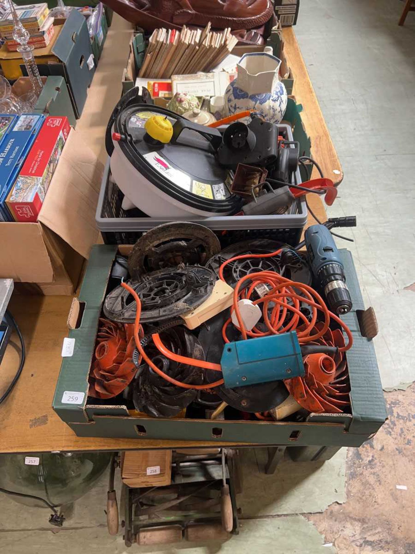 Two boxed containing assorted tools to include cabling, wallpaper stripper, parts of power tools,