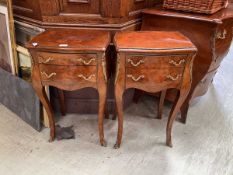A pair of reproduction French style walnut veneered side tables with two drawers