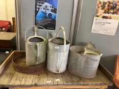 Two galvanized watering cans, mop bucket, backet and garden sieve