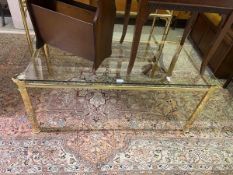 A gilt metal framed coffee table with glass top