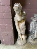 A composite stone garden lady statue