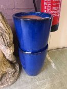 A pair of blue glazed terracotta garden planters