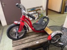 A child's Schwinn tricycle