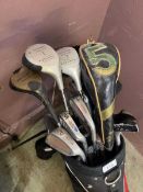 A golf bag containing clubs by various makers to include Howson, Wilson, Slazenger, etc