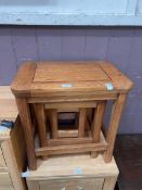 A modern oak nest of three occasional tables by Oak Furnitureland