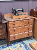 A 20th century distressed oak chest of three drawers