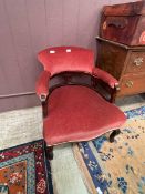 A Victorian mahogany framed hoop back chair with pink upholstery