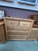 A modern oak chest of two short over three long drawers by Oak Furnitureland