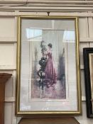 A framed and glazed print circa 1885 depicting a lady arranging flowers 'A Woman Arranging