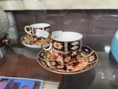 Two Royal Crown Derby Imari pattern coffee cans and saucers