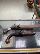 Two reproduction flintlock pistols