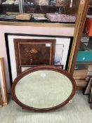 Five various framed pictures and an oval mirror