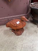A decorative cast iron garden ornament in the form of a duck