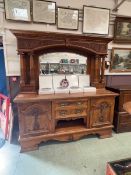 An oak and bird's eye maple veneer sideboard with mirrored back and classical columns with drawers