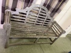 A Lutyens style teak garden bench