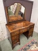 An early 20th century mahogany veneered twin pedestal dressing table with mirror to top over the