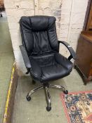 Black upholstered swivel office armchair