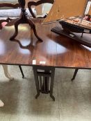 A modern stained wooden sutherland table