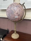 A reproduction globe on wooden stand