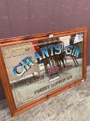 A reproduction pine framed advertising mirror for Grants Gin