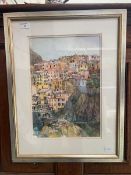 A framed and glazed pen and wash of continental scene signed botton left J Ashcroft '06