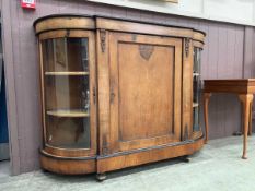 An Edwardian mahogany and strung credenza with cupboard door flanked by two glazed doors