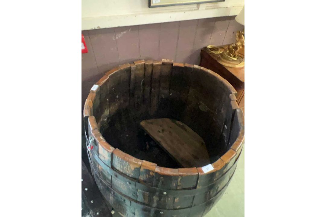 A large oak barrel converted to a plunge pool