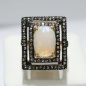 AN OPAL AND DIAMOND DRESS RING.