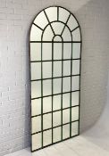 ARCHED WINDOW MIRROR.