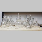 A LARGE COLLECTION OF ASSORTED GLASSWARE AND DECANTERS. (QTY).