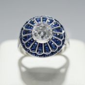 A PLATINUM SAPPHIRE AND DIAMOND COCKTAIL RING.