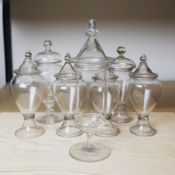 A COLLECTION OF SEVEN GLASS APOTHECARY JARS (7).