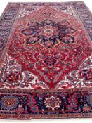 ANTIQUE PERSIAN HERIZ CARPET.