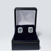 A PAIR OF 18CT WHITE GOLD AQUAMARINE AND DIAMOND STUD EARRINGS.