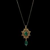 AN EMERALD AND DIAMOND PENDANT.