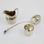 A GEORGIAN SILVER SOUP LADLE, CREAM JUG AND A STERLING BEAKER. (3).