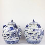 PAIR OF CHINESE BLUE AND WHITE CERAMIC LIDDED TEMPLE JARS.