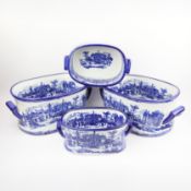 SET OF FOUR BLUE AND WHITE IRONSTONE STYLE CERAMIC PLANTERS.