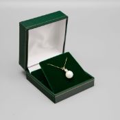 A 9CT GOLD PEARL AND DIAMOND PENDANT NECKLACE.