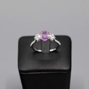 A PLATINUM PINK SAPPHIRE AND DIAMOND TRILOGY RING.