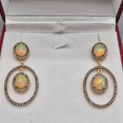 PAIR OF SILVER-GILT CHANDELIER STYLE ARTICULATED DROP EARRINGS.