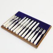 A SET OF WILLIAM HUTTON & SONS MOTHER-OF-PEARL SILVER FRUIT KNIVES AND FORKS.