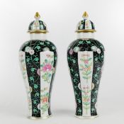 A PAIR OF HEREND PORCELAIN FAMILLE NOIRE LIDDED VASES. (2).