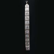 A WHITE METAL DIAMOND ENCRUSTED BRACELET.