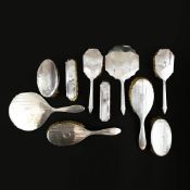 TWO SILVER BACKED BRUSH SETS.