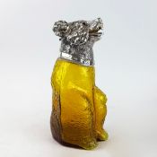 POLISHED METAL AND YELLOW GLASS BEAR CLARET JUG.
