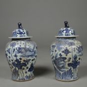 CHINESE STYLE CERAMIC TEMPLE JARS, A PAIR.
