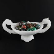AN ALABASTER CENTERPIECE SWAN BOWL WITH POLISHED SEMI-PRECIOUS STONE SPHERES.