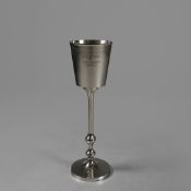 POLISHED METAL CHAMPAGNE COOLER ON STAND.